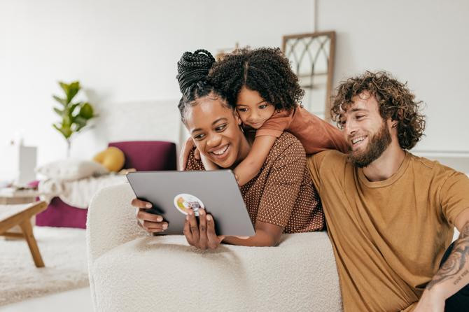 A family learning about safe internet use together.